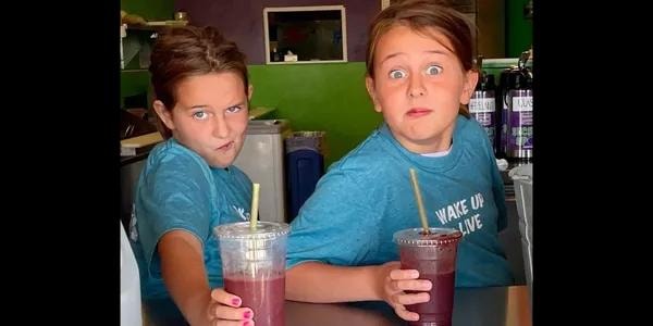 Two kids enjoying smoothies at Secret Spot NH