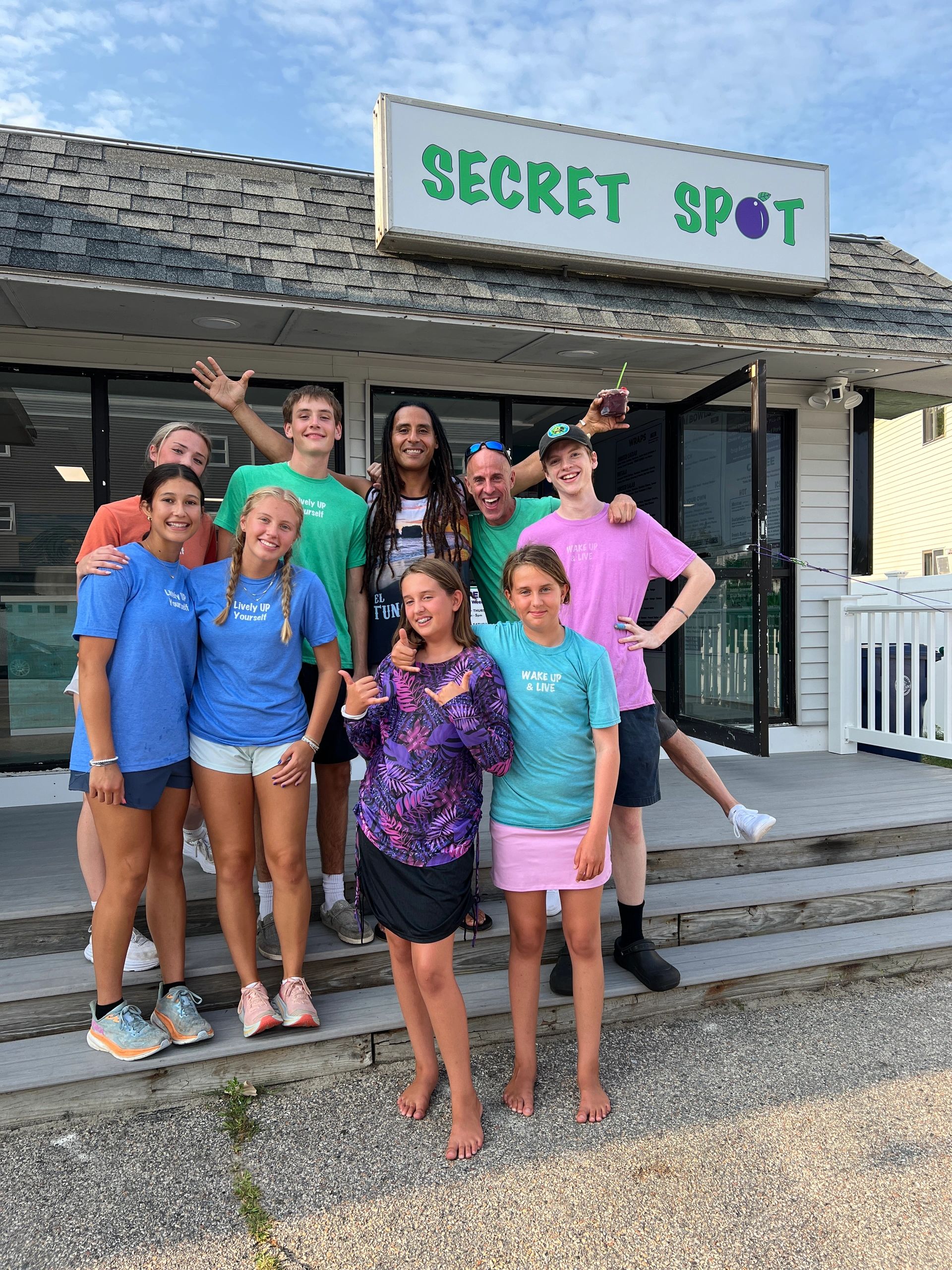 Group of people in front of Secret Spot storefront