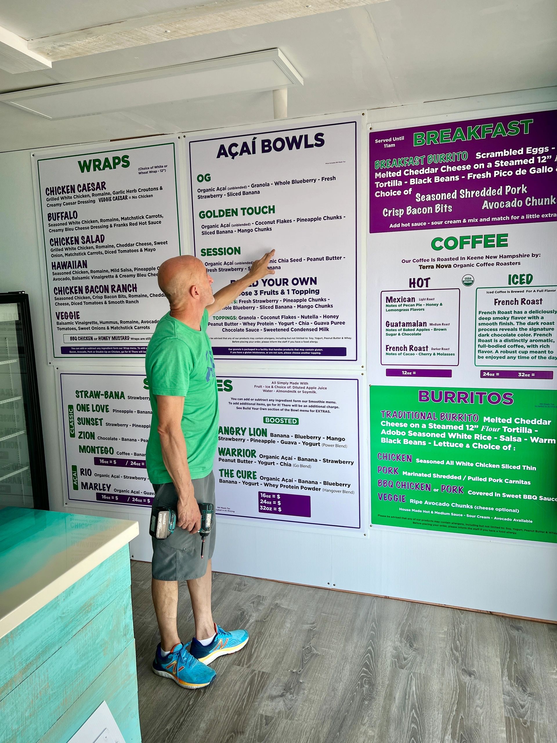Customer reading Secret Spot menu board